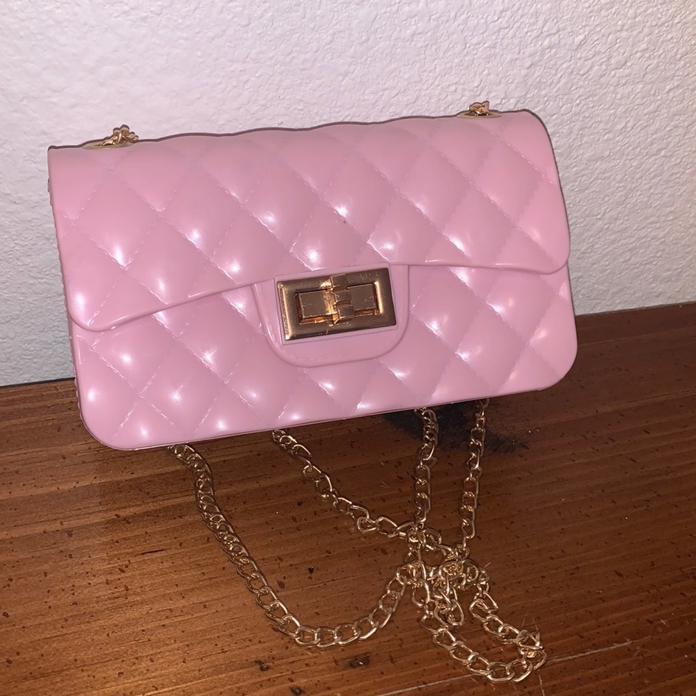 Mini pink clutch purse. Adjustable straps. Quilted pattern